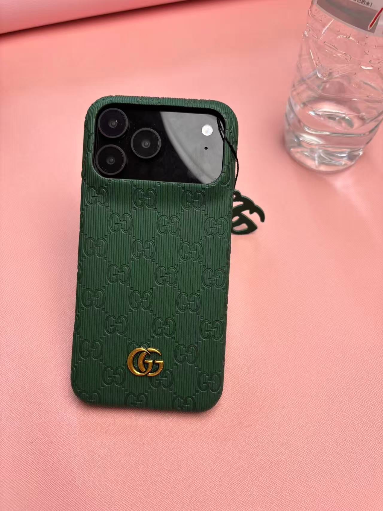 Gucci Embossed GG Ribbed iPhone Case with Logo Charm – iPhone 13 to 17 Pro Max