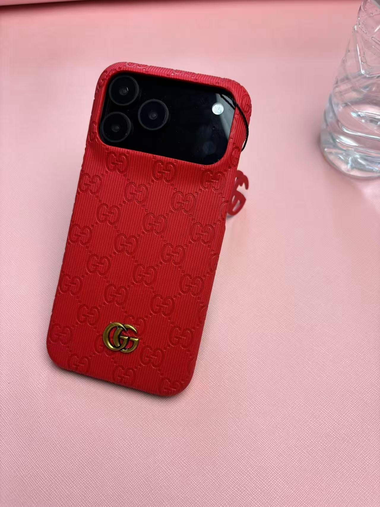 Gucci Embossed GG Ribbed iPhone Case with Logo Charm – iPhone 13 to 17 Pro Max