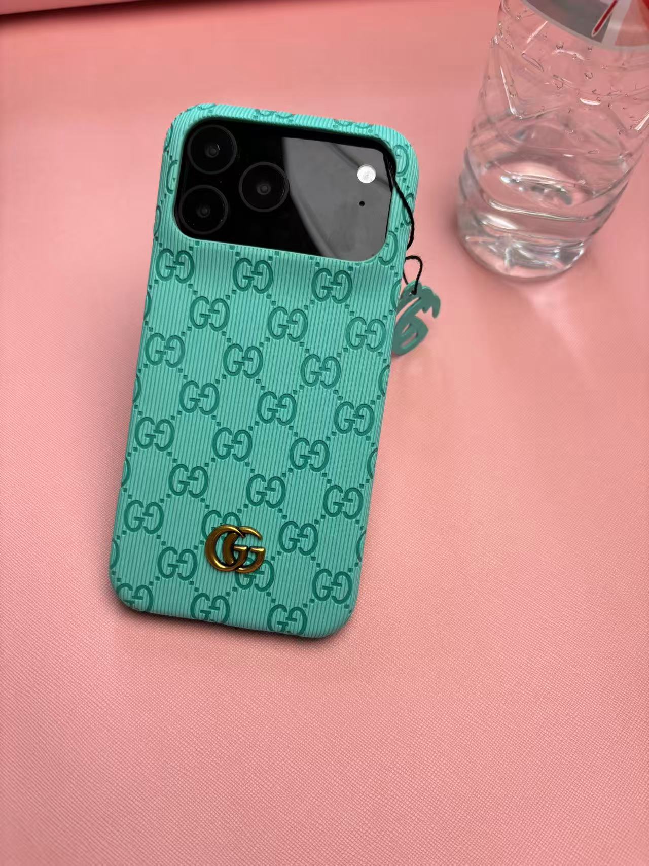 Gucci Embossed GG Ribbed iPhone Case with Logo Charm – iPhone 13 to 17 Pro Max