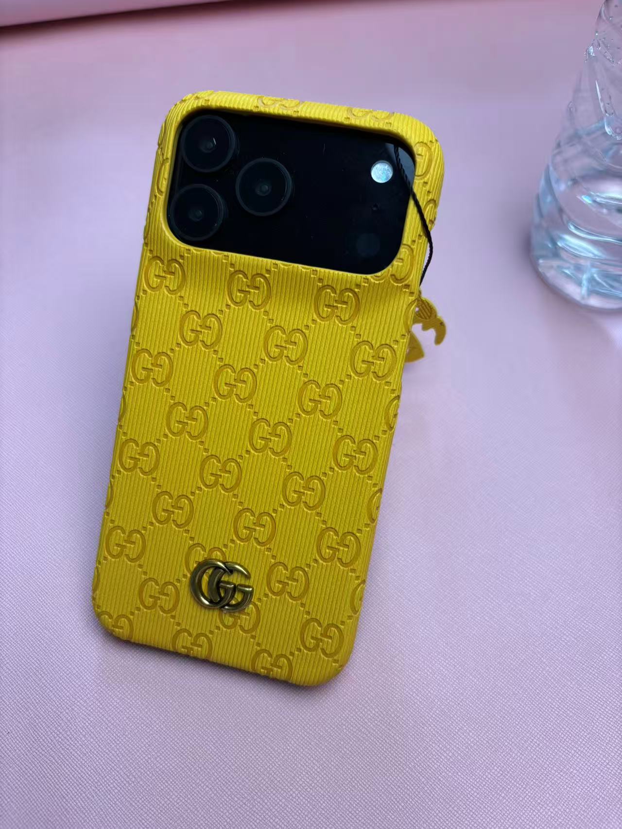 Gucci Embossed GG Ribbed iPhone Case with Logo Charm – iPhone 13 to 17 Pro Max