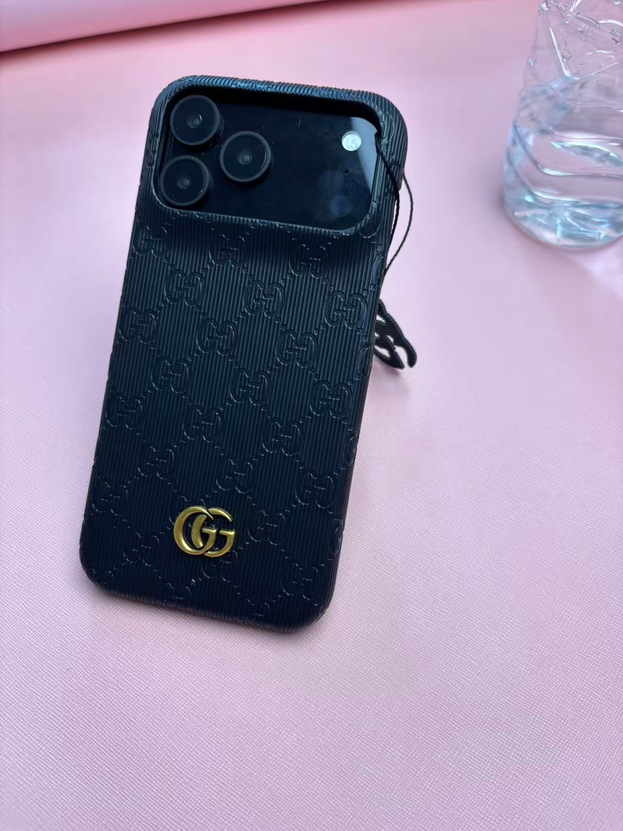 Gucci Embossed GG Ribbed iPhone Case with Logo Charm – iPhone 13 to 17 Pro Max