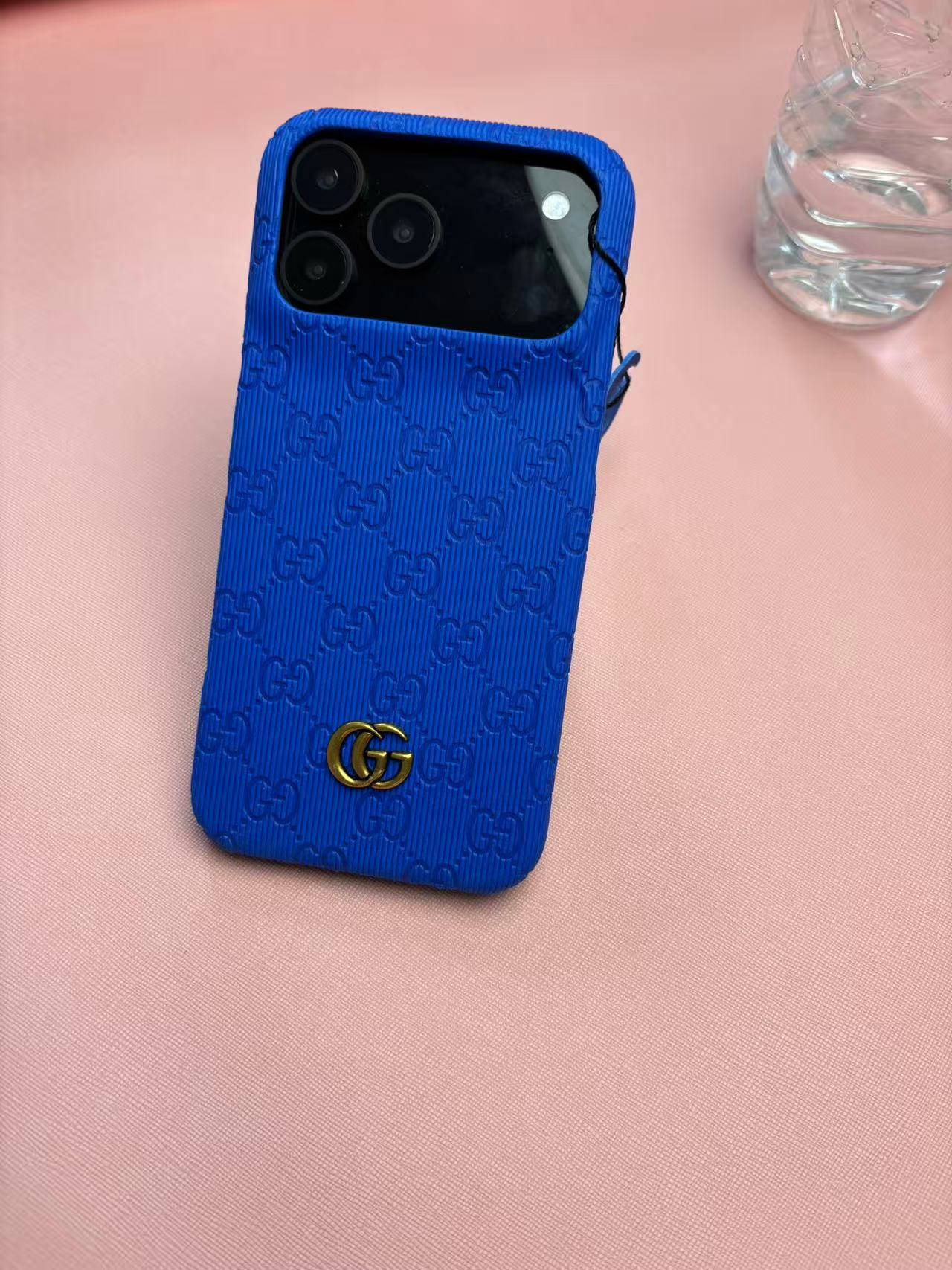 Gucci Embossed GG Ribbed iPhone Case with Logo Charm – iPhone 13 to 17 Pro Max